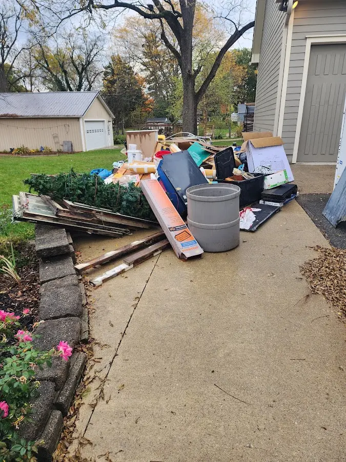 Dumpster being loaded with debris for 30 Yard Dumpster Rental in Hyde Park